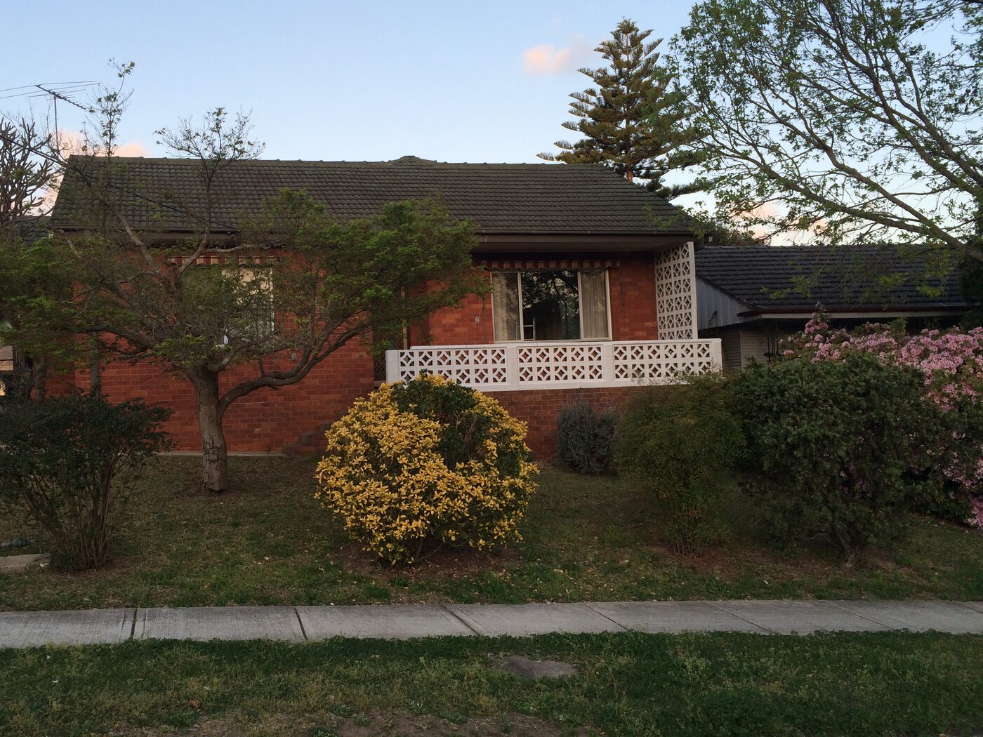 Before — The original single-storey brick home before, and the completed two-storey rebuild after