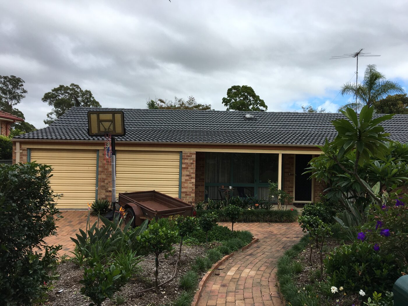 Before — The original single-storey Cherrybrook home before, and the completed two-storey home after a full upper floor was added