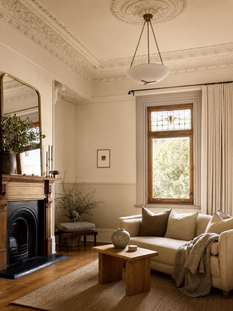 Restored Federation-era Sydney interior — ornate ceiling rose, restored fireplace, leadlight window and timber floors — illustrative concept